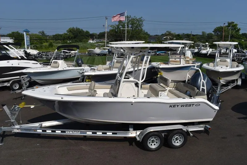 Slide: The Image of 2024 Key West 203 FS boat on trailer in outdoor showroom. - 6