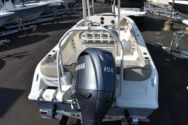 Slide: The Image of 2024 Key West 203 FS boat with Yamaha 150 engine, parked on a trailer. - 9