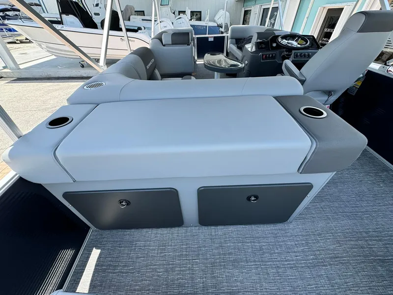 Slide: The Image of 2025 Bennington 22ss-sps pontoon boat interior with gray seating and cup holders. - 11