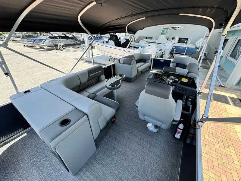 Slide: The Image of 2025 Bennington 22ss-sps pontoon boat interior with seating and helm. - 13