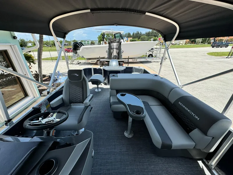Slide: The Image of 2025 Bennington 22ss-sps pontoon boat interior with seating and steering console. - 15