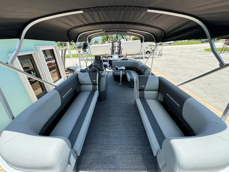 Slide: The Image of 2025 Bennington 22ss-sps pontoon boat interior with spacious seating and canopy. - 23