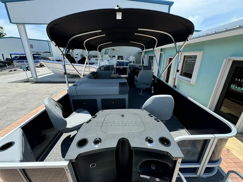 Slide: The Image of 2025 Bennington 22ss-sps pontoon boat with canopy, spacious seating, and modern design. - 6