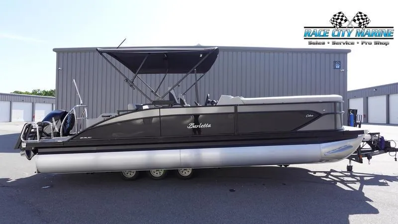 The Image of 2025 Barletta C24UC pontoon boat parked outside Race City Marine. - 0