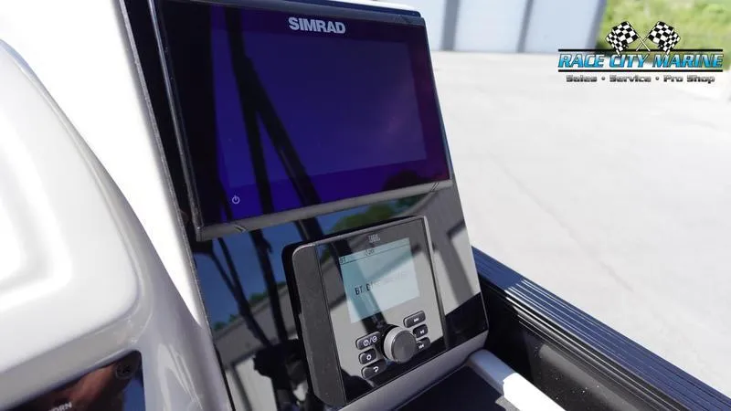 Slide: The Image of Simrad display on 2025 Barletta C24UC boat dashboard at Race City Marine. - 13