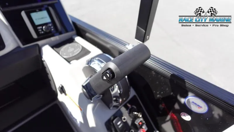 Slide: The Image of 2025 Barletta C24UC boat control panel with throttle and display screen. - 14