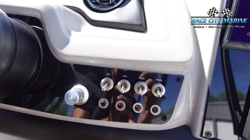Slide: The Image of Control panel of 2025 Barletta C24UC boat with switches and knobs. - 17
