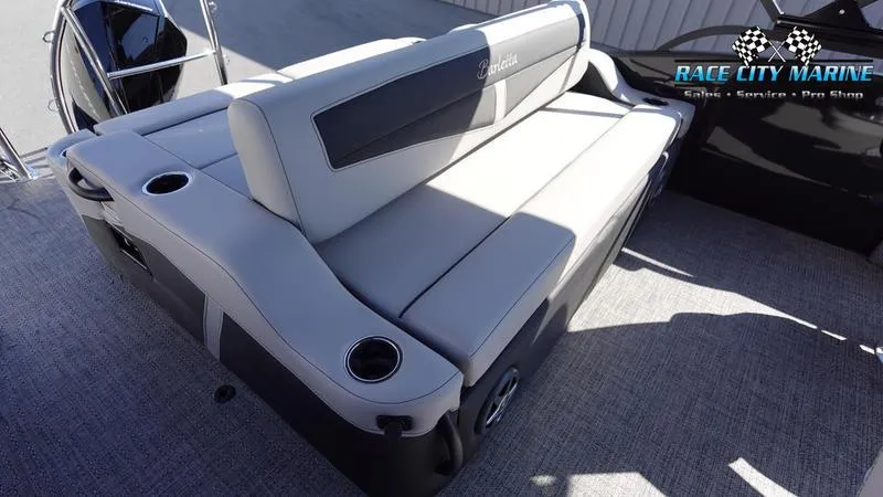 Slide: The Image of 2025 Barletta C24UC boat interior with plush seating and cup holders. - 20