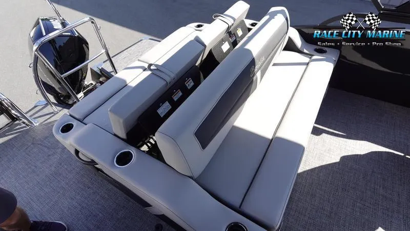 Slide: The Image of 2025 Barletta C24UC boat interior with plush seating and cup holders. - 22