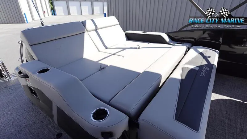 Slide: The Image of 2025 Barletta C24UC boat interior with plush seating at Race City Marine. - 25