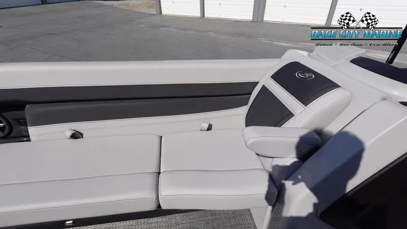 Slide: The Image of 2025 Barletta C24UC boat interior with sleek white and black seating. - 27