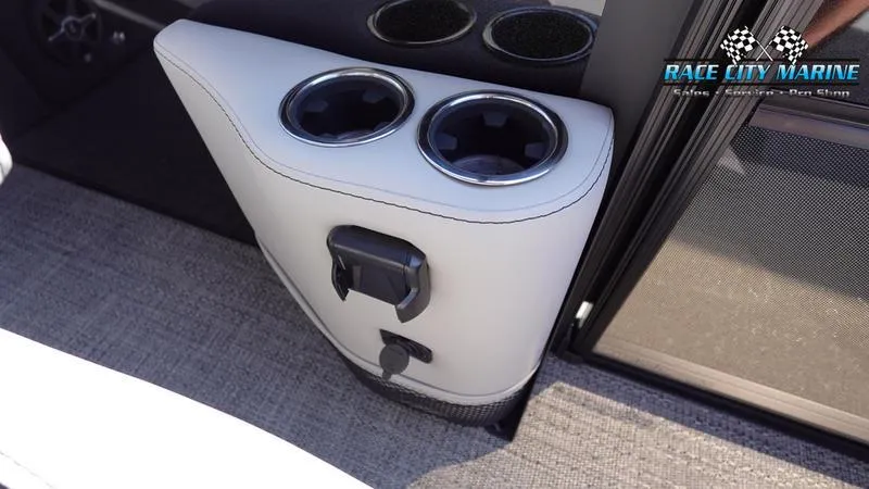 Slide: The Image of Barletta C24UC 2025 boat interior with cup holders and charging ports. - 29