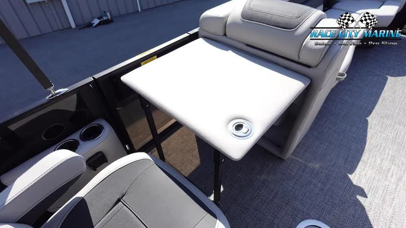 Slide: The Image of 2025 Barletta C24UC boat interior with seating and table, Race City Marine logo visible. - 30