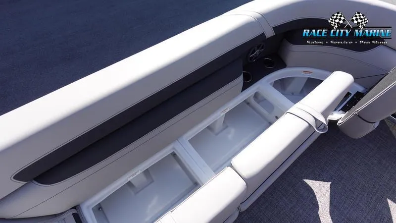 Slide: The Image of Barletta C24UC 2025 boat interior with open storage compartments and seating. - 34