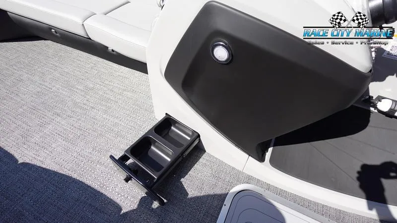 Slide: The Image of Barletta C24UC 2025 boat interior with cup holders and Race City Marine logo. - 36