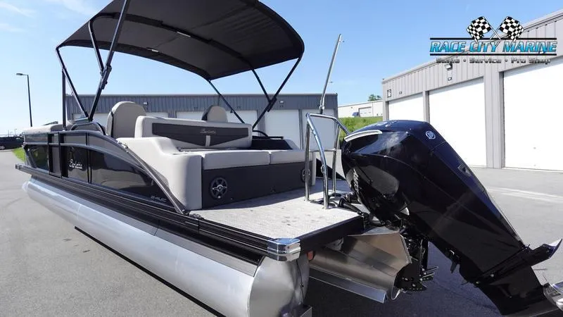 Slide: The Image of 2025 Barletta C24UC pontoon boat with outboard motor at Race City Marine. - 5