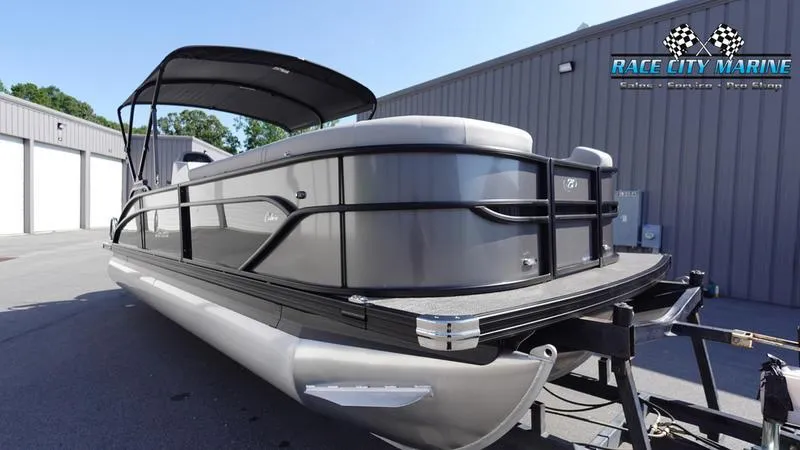 Slide: The Image of 2025 Barletta C24UC pontoon boat on trailer at Race City Marine. - 7