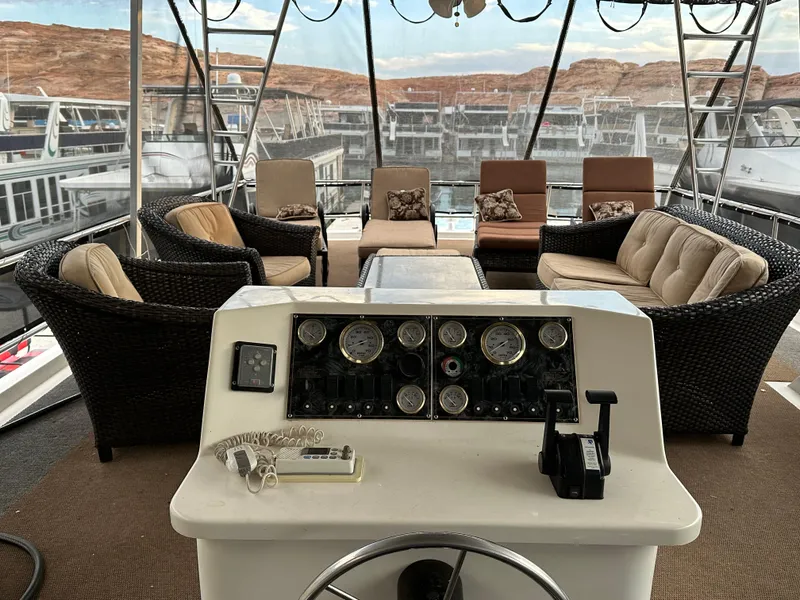 Slide: The Image of Luxurious 2001 Custom Endless Summer boat interior with plush seating and control panel. - 18