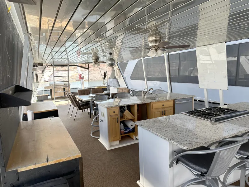 Slide: The Image of Spacious boat interior with kitchen and dining area, Custom Endless Summer 2001 model. - 22