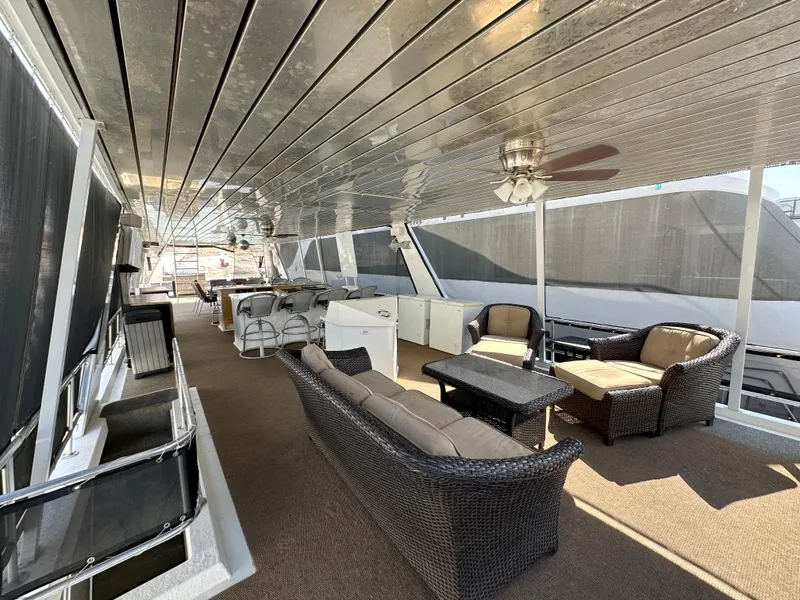 Slide: The Image of Spacious deck of 2001 Custom Endless Summer yacht with comfortable seating and modern amenities. - 23