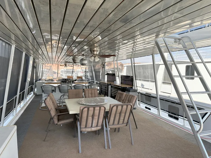 Slide: The Image of Spacious deck of 2001 Custom Endless Summer yacht with dining area and seating. - 26
