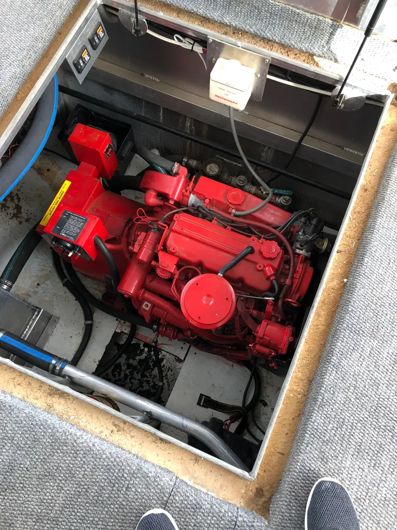 Slide: The Image of Red engine in a 2001 Custom Endless Summer boat, viewed from above. - 3