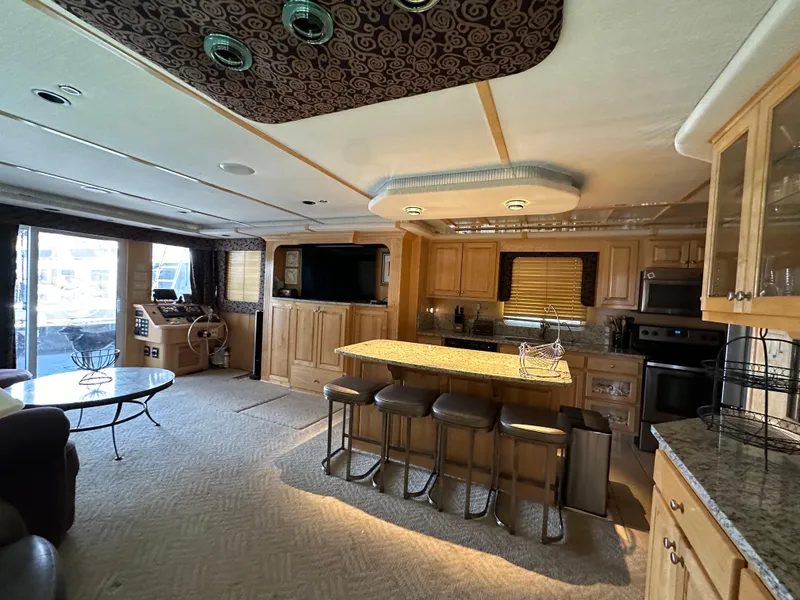 Slide: The Image of Luxurious 2001 Custom Endless Summer yacht interior with modern kitchen and spacious living area. - 33