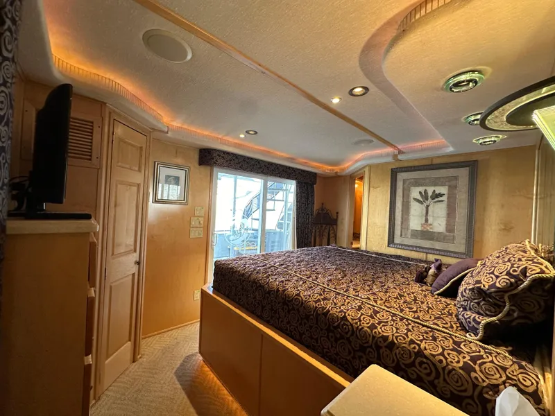 Slide: The Image of Luxurious bedroom interior in 2001 Custom Endless Summer model, featuring elegant lighting and decor. - 37
