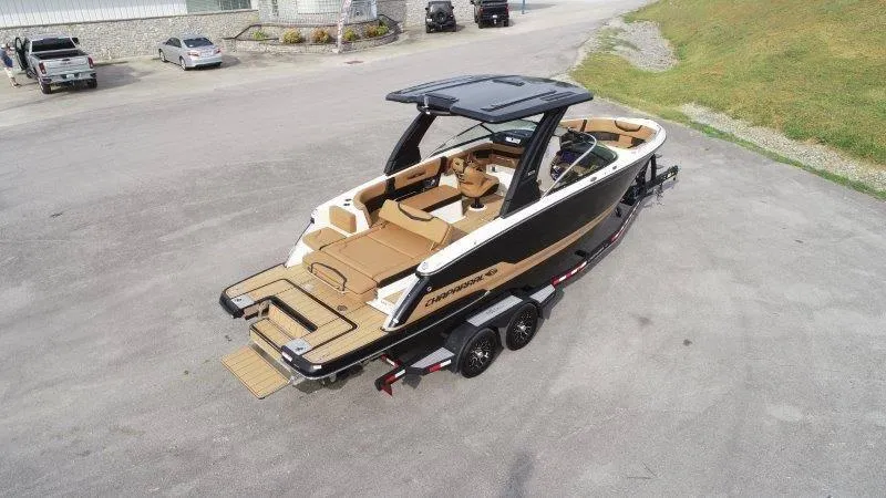 Slide: The Image of 2025 Chaparral 287 SSX boat on trailer, featuring sleek design and spacious interior. - 13