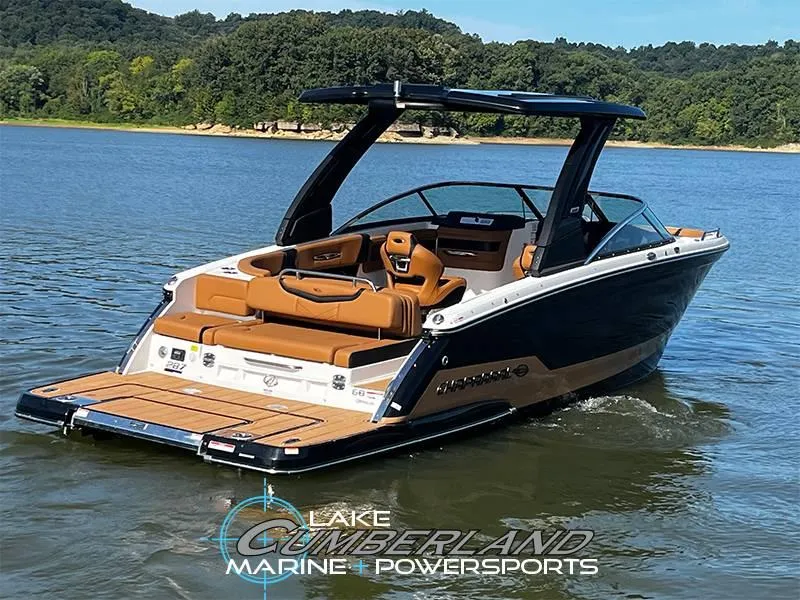 Slide: The Image of 2025 Chaparral 287 SSX boat on a lake, featuring sleek design and luxurious seating. - 2