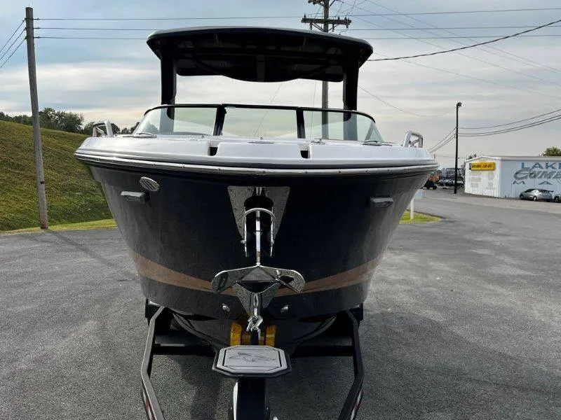 Slide: The Image of 2025 Chaparral 287 SSX boat on trailer, front view, parked outdoors. - 32