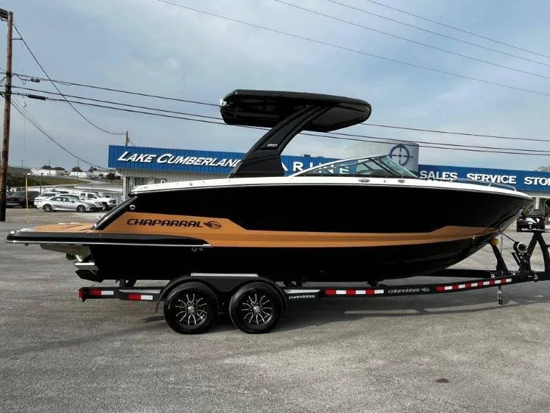 Slide: The Image of 2025 Chaparral 287 SSX boat on trailer at dealership, side view. - 33