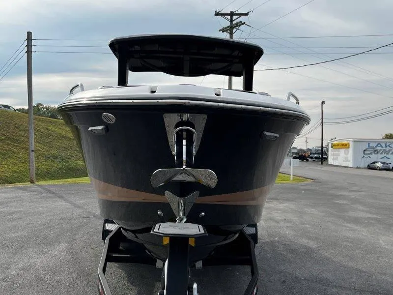 Slide: The Image of 2025 Chaparral 287 SSX boat front view on trailer, outdoor setting. - 35