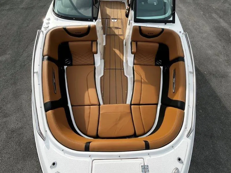 Slide: The Image of 2025 Chaparral 287 SSX boat interior with tan leather seating and sleek design. - 40