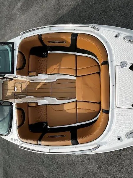 Slide: The Image of 2025 Chaparral 287 SSX boat interior with tan leather seating and sleek design. - 42