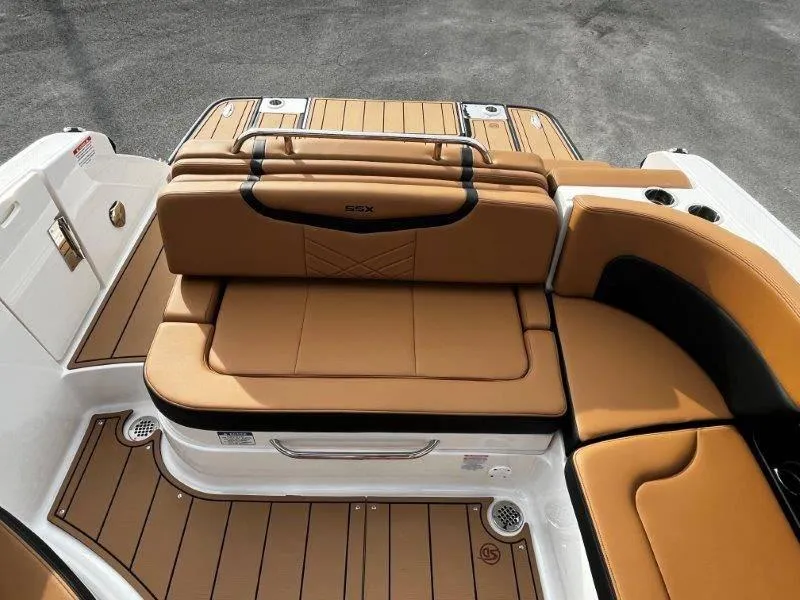 Slide: The Image of 2025 Chaparral 287 SSX boat with tan leather seating and sleek design. - 48