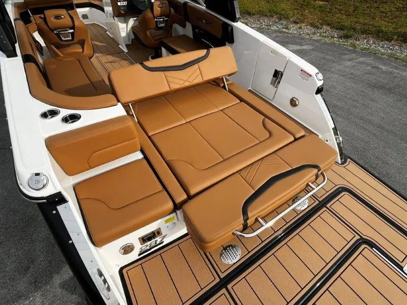 Slide: The Image of 2025 Chaparral 287 SSX boat interior with tan leather seating and sleek design. - 51