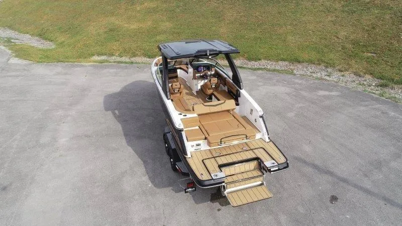 Slide: The Image of 2025 Chaparral 287 SSX boat with spacious deck and luxurious seating. - 8