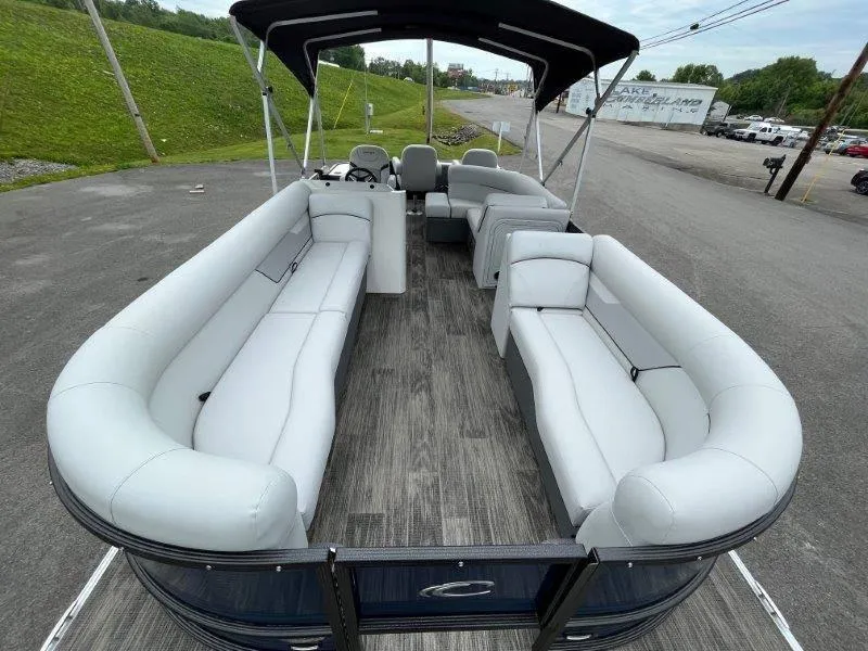 Slide: The Image of 2023 Crest Classic Fish 220 SF pontoon boat with spacious seating and canopy. - 19