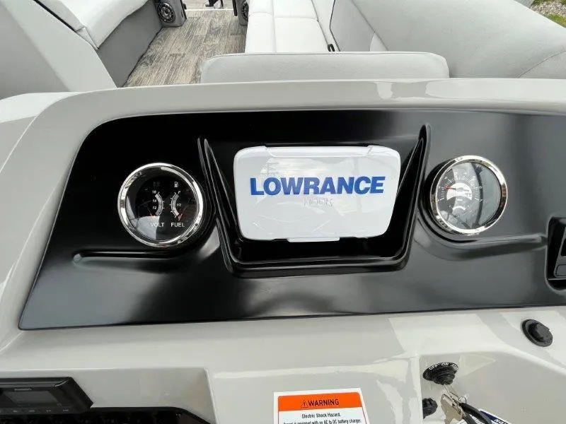 Slide: The Image of Dashboard of 2023 Crest Classic Fish 220 SF with Lowrance display and gauges. - 20