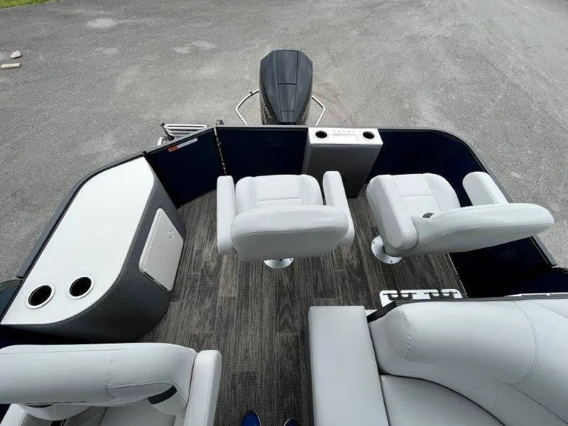 Slide: The Image of 2023 Crest Classic Fish 220 SF boat interior with swivel seats and modern design. - 25