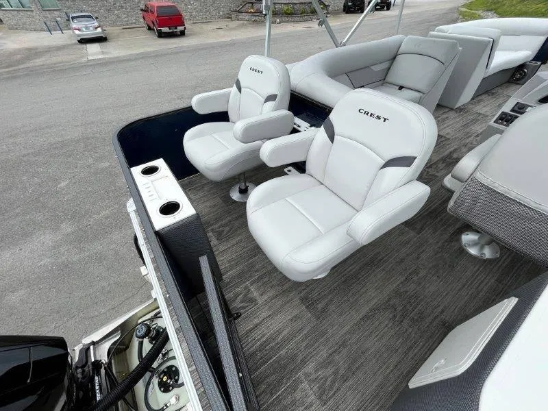 Slide: The Image of 2023 Crest Classic Fish 220 SF boat interior with plush seating and modern design. - 27