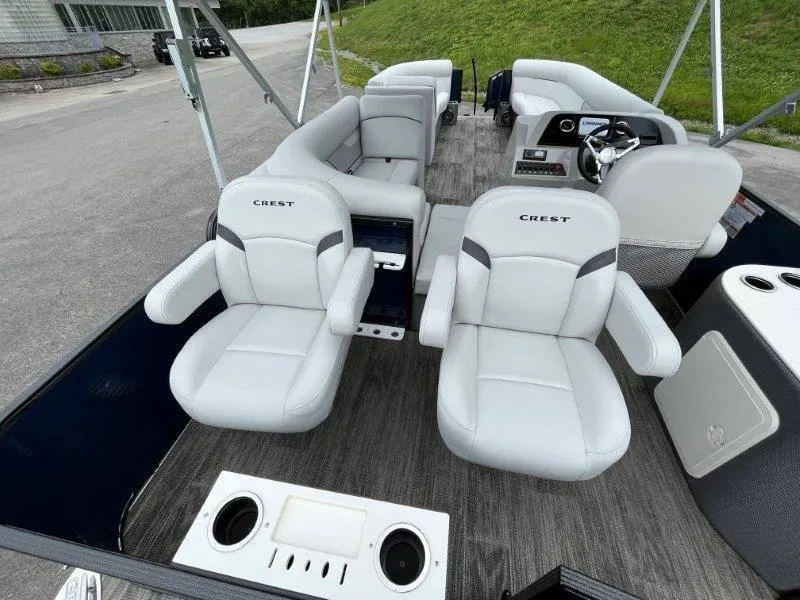 Slide: The Image of 2023 Crest Classic Fish 220 SF boat interior with plush seating and modern design. - 33
