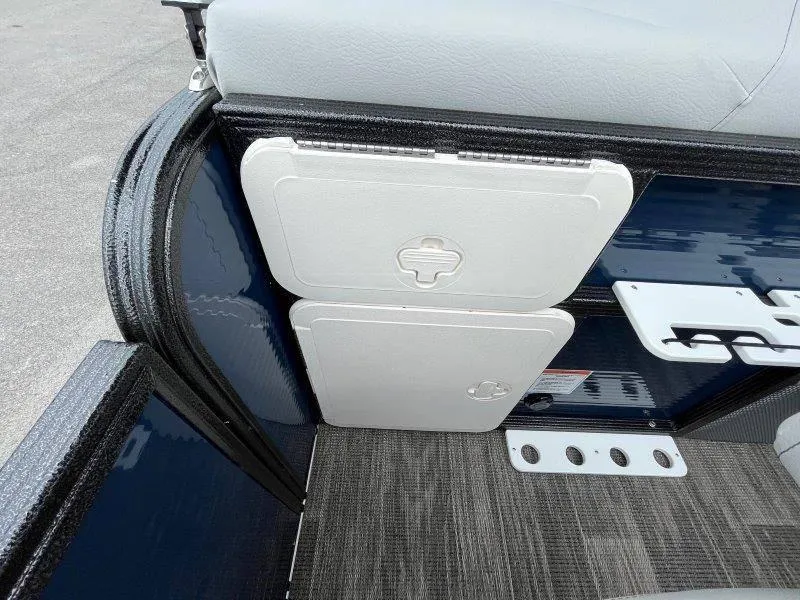 Slide: The Image of 2023 Crest Classic Fish 220 SF boat interior with storage compartments and seating. - 35