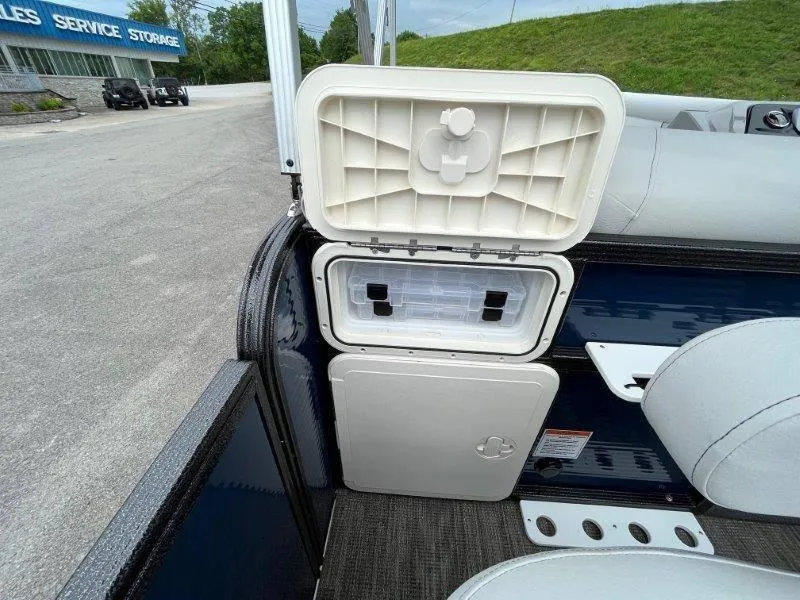 Slide: The Image of 2023 Crest Classic Fish 220 SF boat storage compartments open, showcasing interior features. - 37