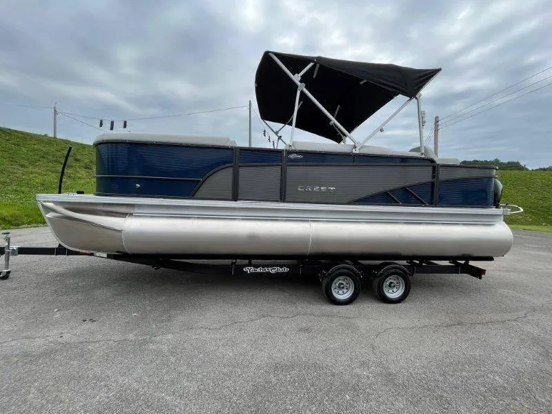 Slide: The Image of 2023 Crest Classic Fish 220 SF pontoon boat with canopy on trailer. - 4