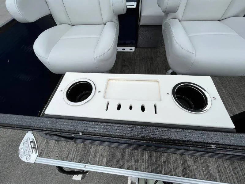 Slide: The Image of 2023 Crest Classic Fish 220 SF boat interior with cup holders and seating. - 40