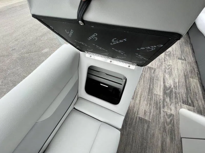 Slide: The Image of 2023 Crest Classic Fish 220 SF boat seat storage compartment open. - 49