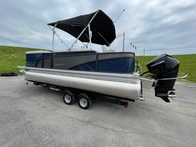 Slide: The Image of 2023 Crest Classic Fish 220 SF pontoon boat on trailer with Mercury outboard motor. - 5