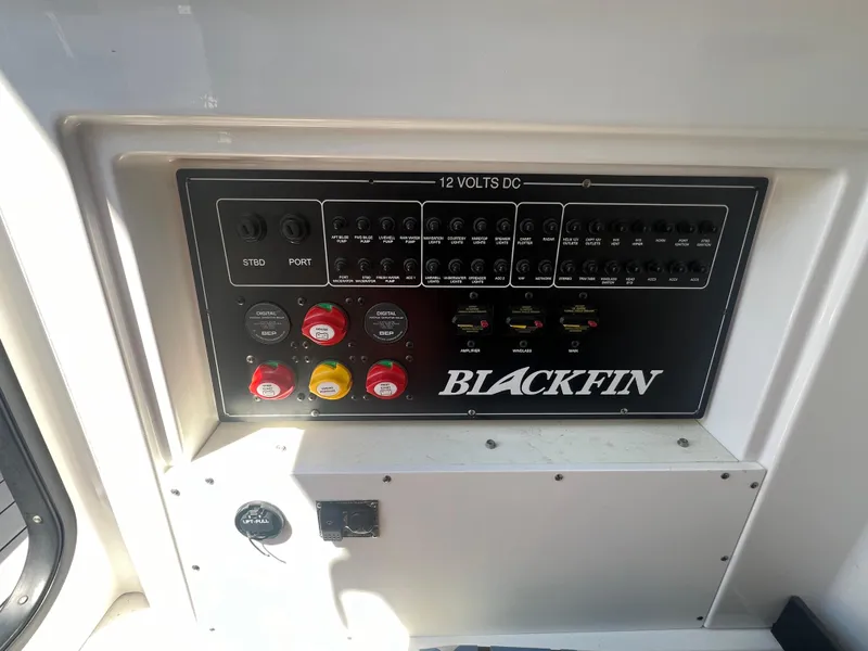 Slide: The Image of Blackfin 272 CC 2020 boat control panel with switches and labels. - 15